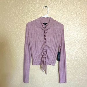 Size M lightly ruffled mock neck.
long sleeves.
pink color.
